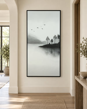 A Place Untouched monochrome lake wall art above a console table in a hallway