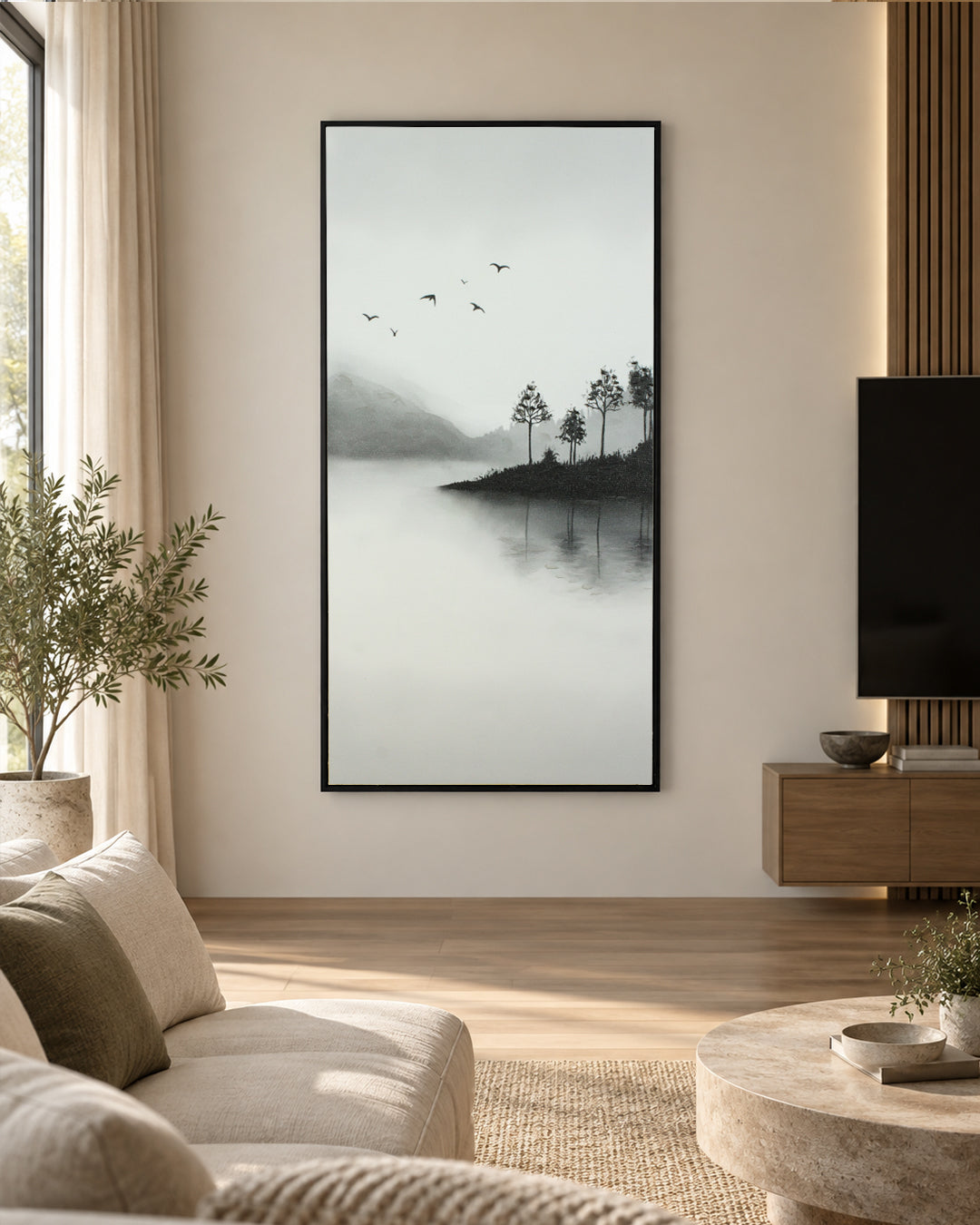 A Place Untouched monochrome lake wall art above a sofa in a living room