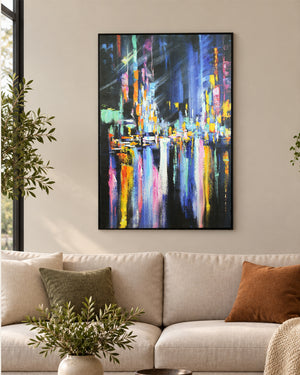 After Hours abstract cityscape painting above a sofa in a living room