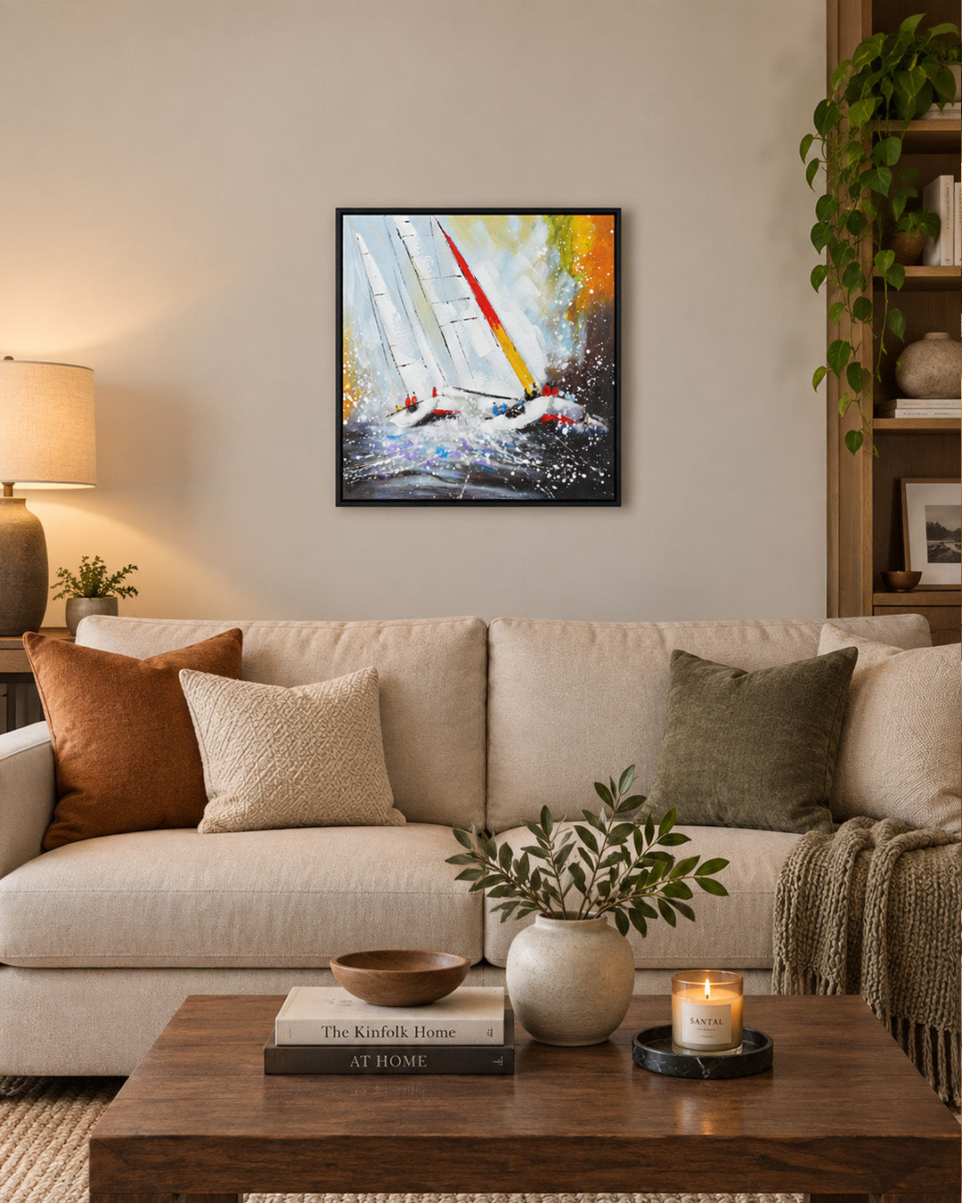 Against the Tide textured sailing painting above a sofa in a living room