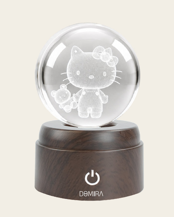 Sweet Adventure crystal globe front view on its rotating LED base
