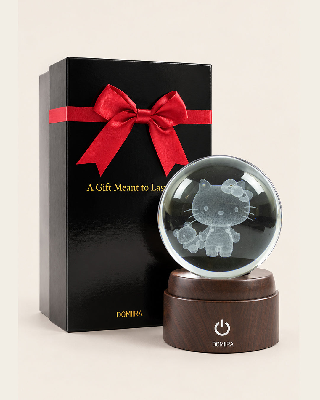 Sweet Adventure crystal globe beside its ribbon-finished gift box