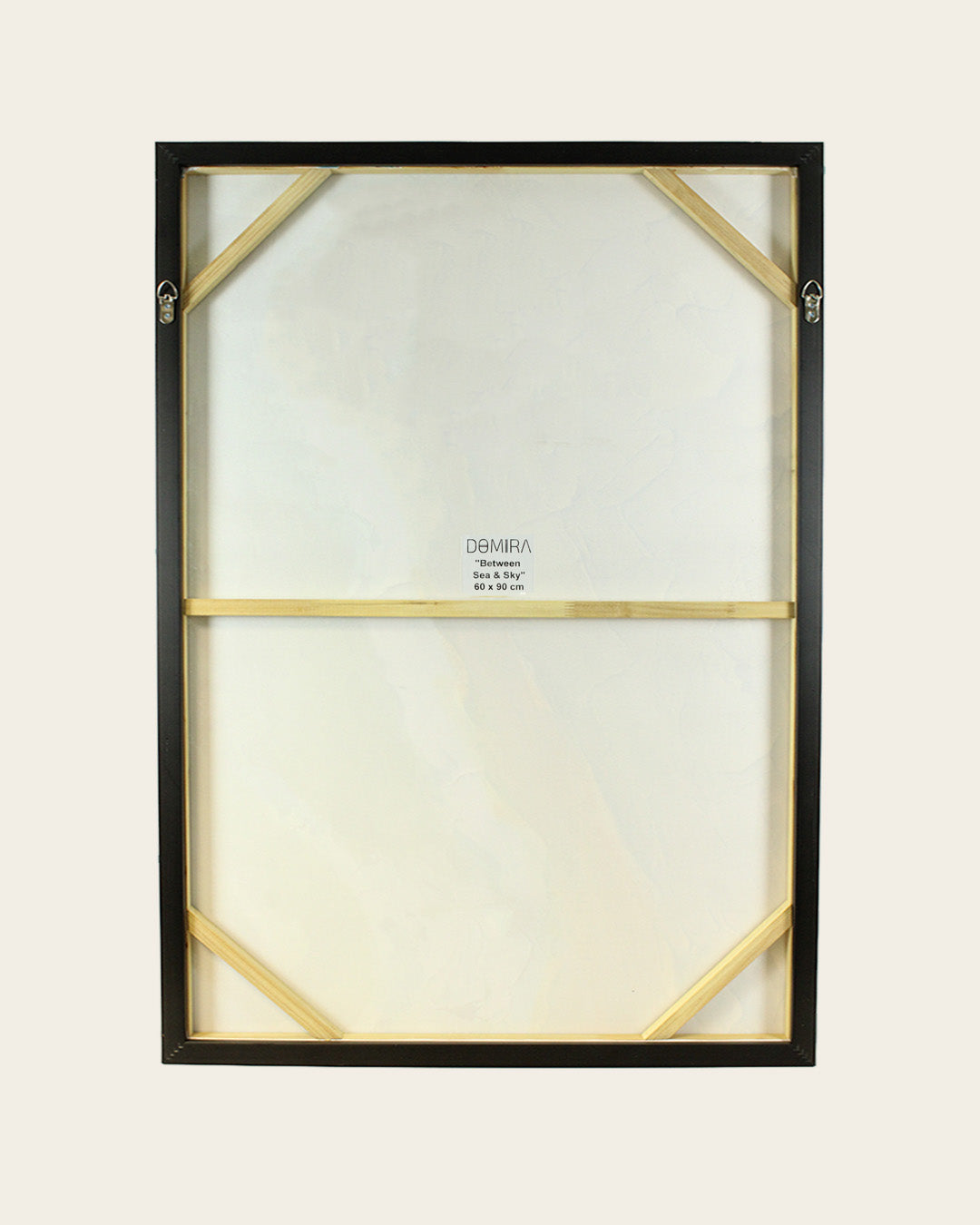 Between Sea & Sky black and white sailboat painting back of the framed canvas