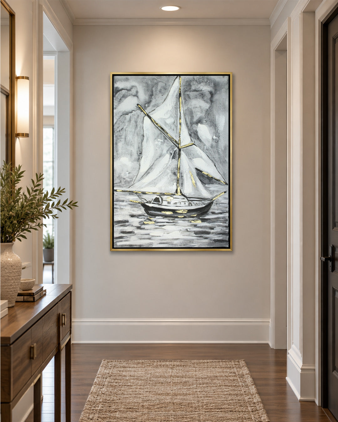 Between Sea & Sky black and white sailboat painting in a hallway