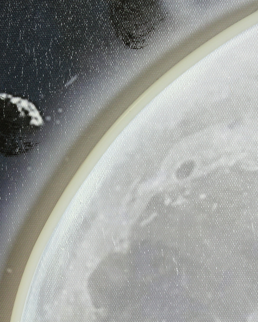 Beyond Infinity astronaut and moon LED wall art close-up of the moon and LED edge
