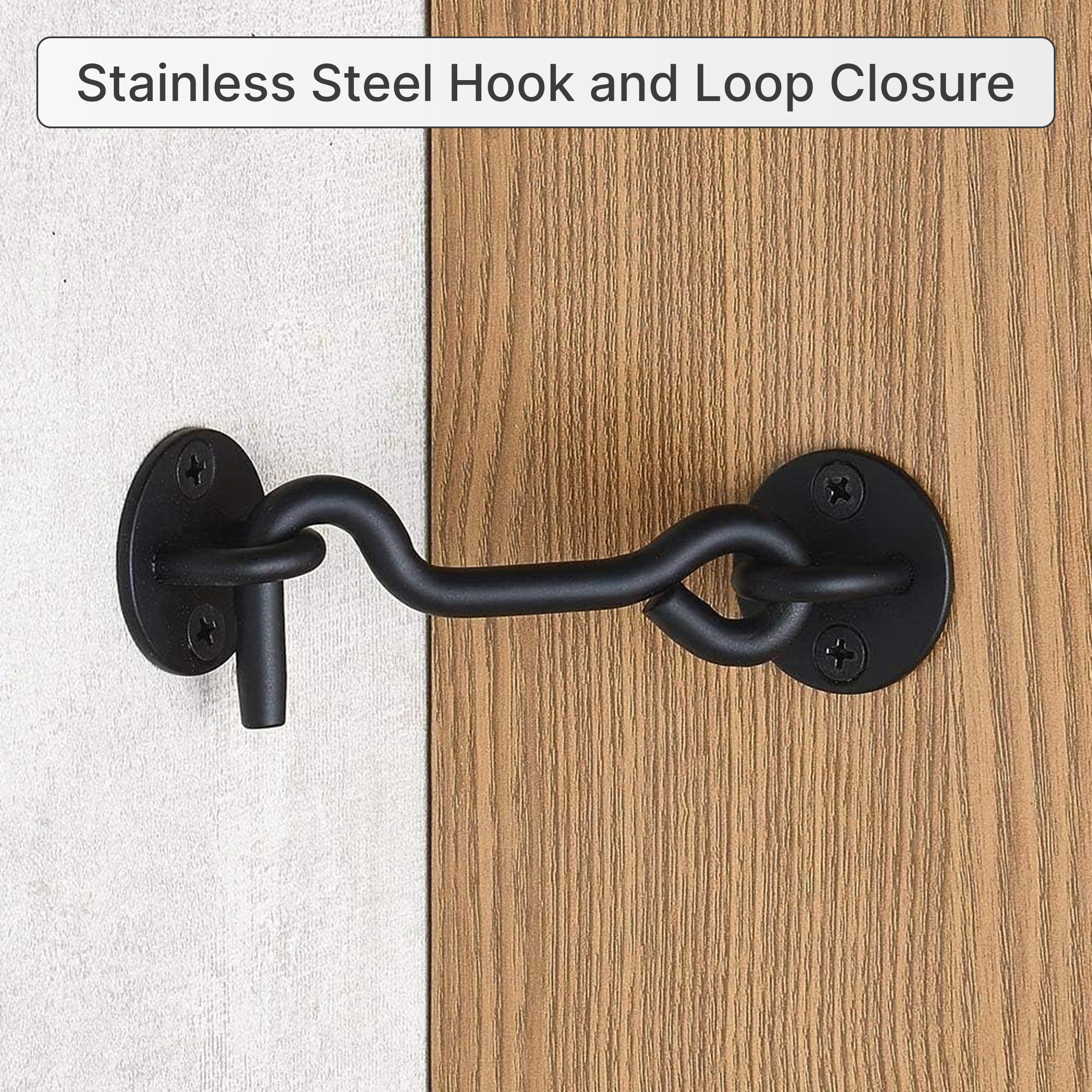 Black hook and eye latch installed on a door