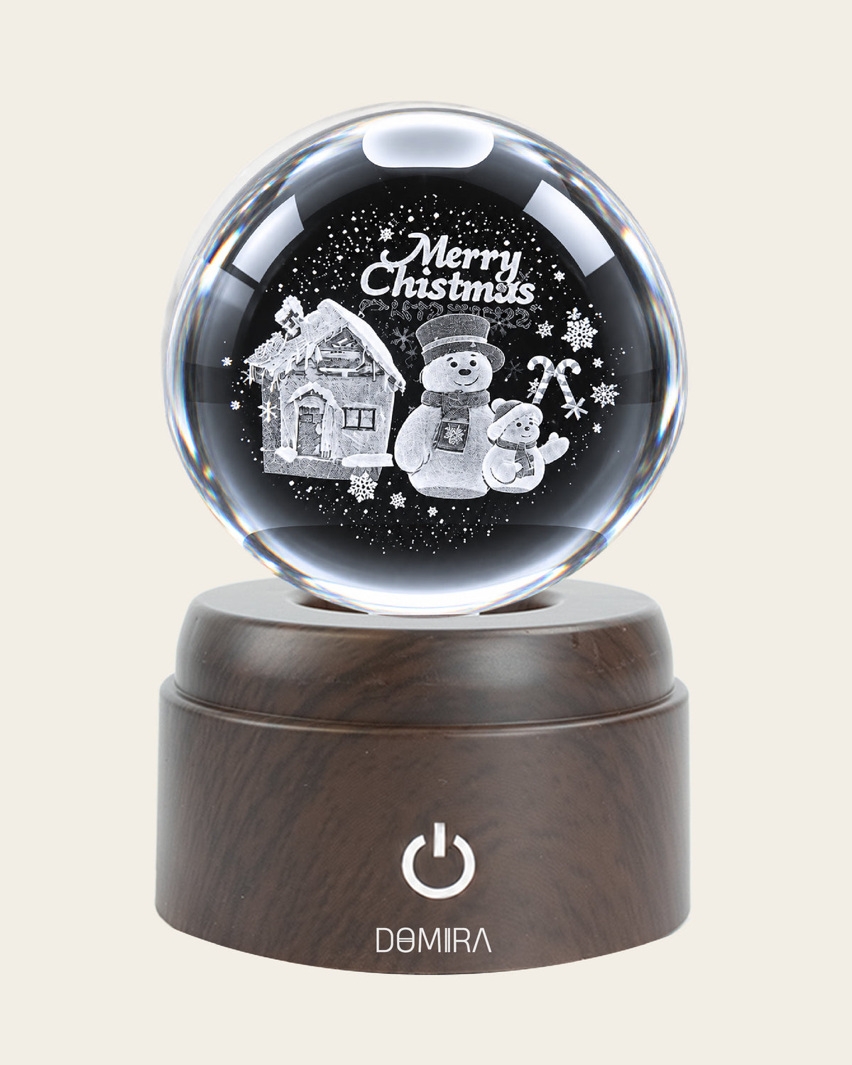 A Snowy Christmas crystal globe close-up of the 3D engraved design