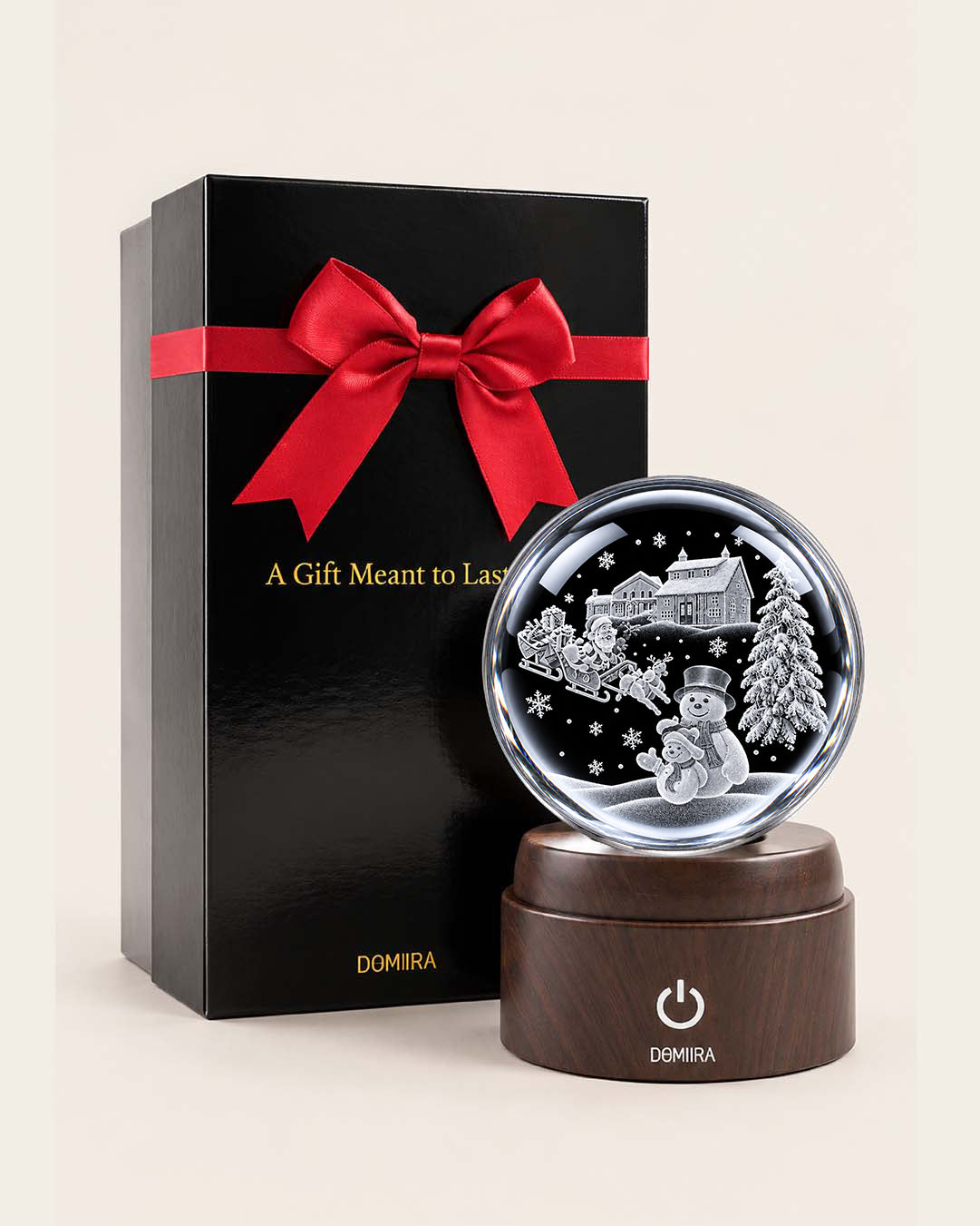 Festive Winter crystal globe beside its ribbon-finished gift box