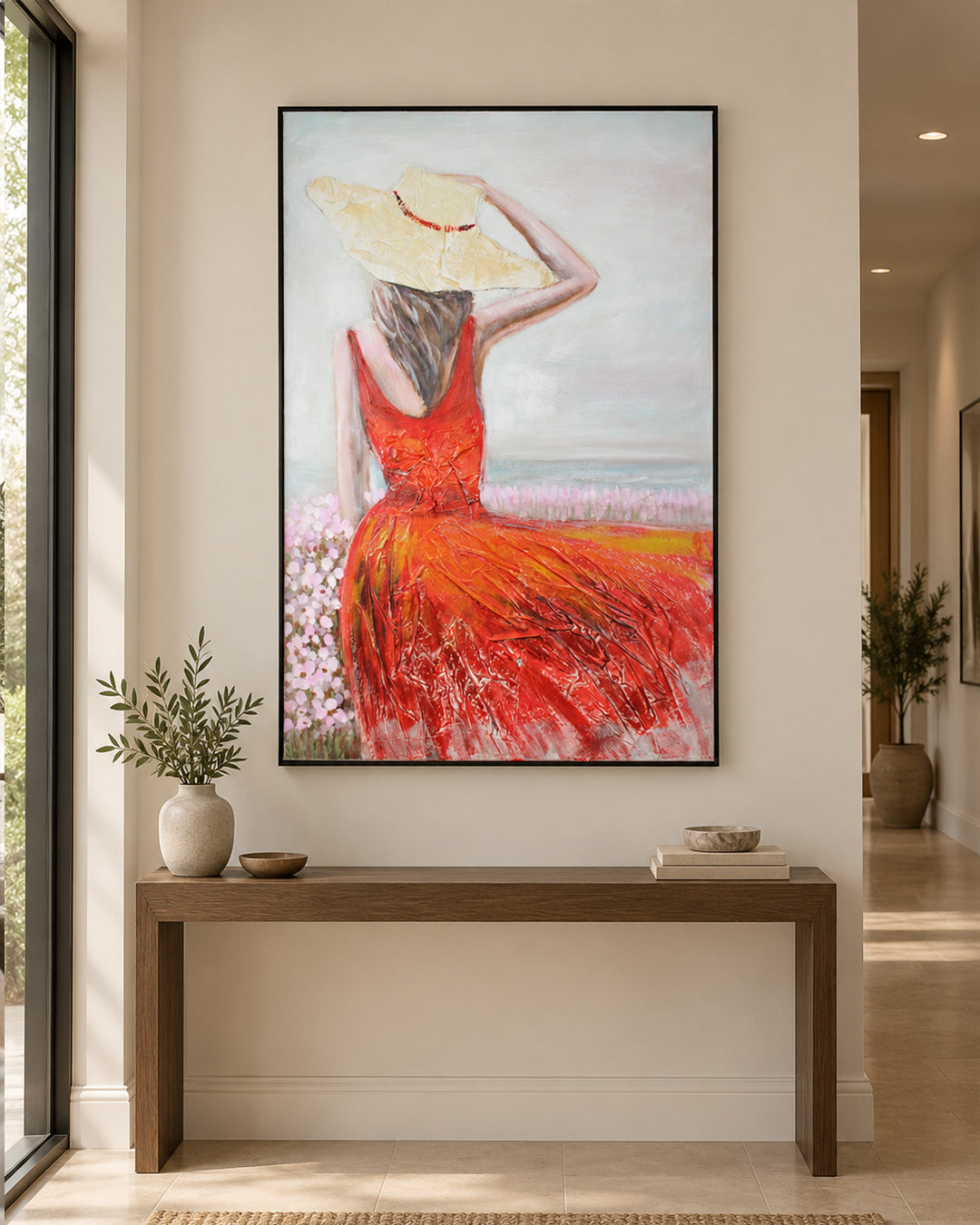 Crimson Shore woman in red dress painting in a hallway