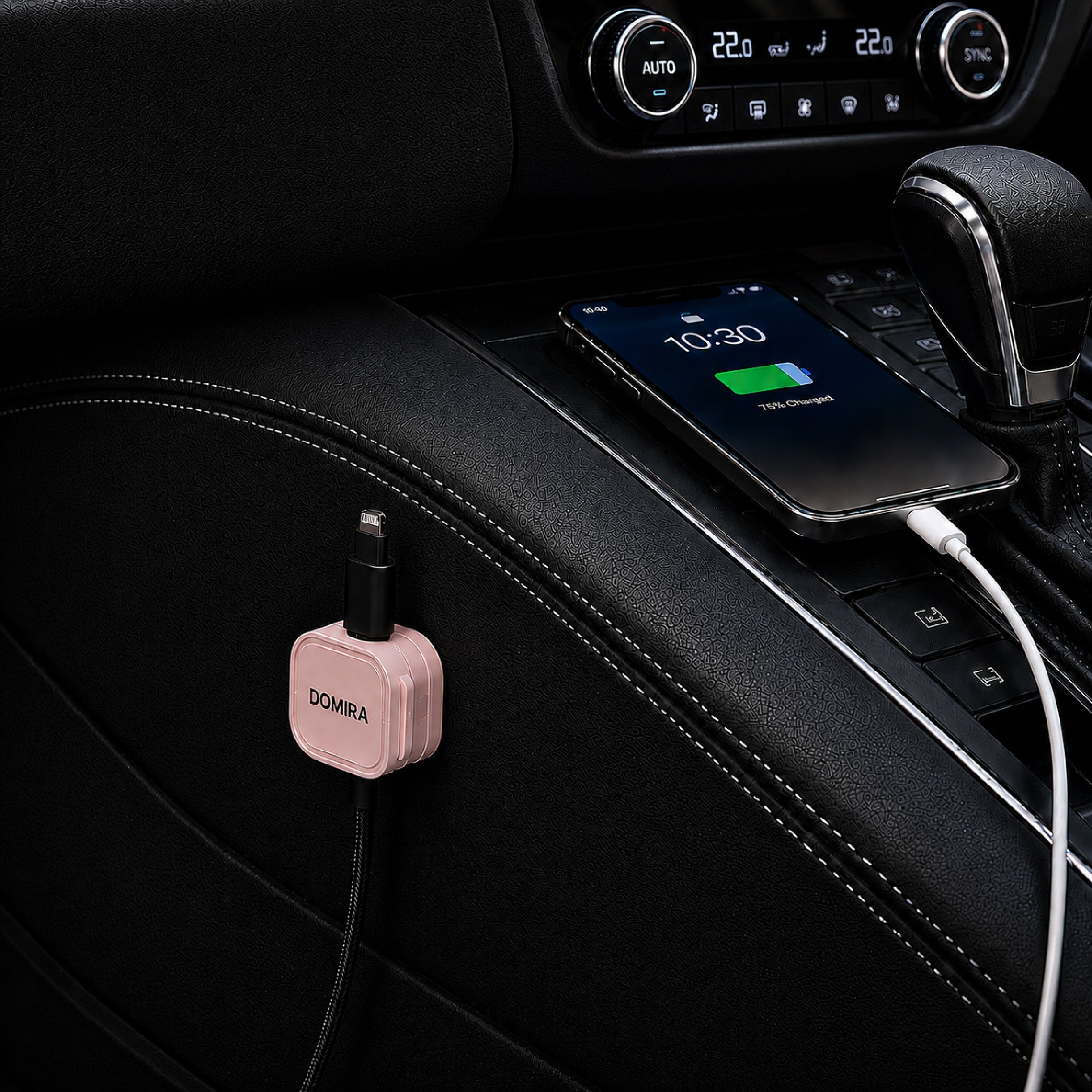 DOMIRA Pink magnetic cable holder
clips used in a car to organise charging
cables, USB cables and AUX cords.