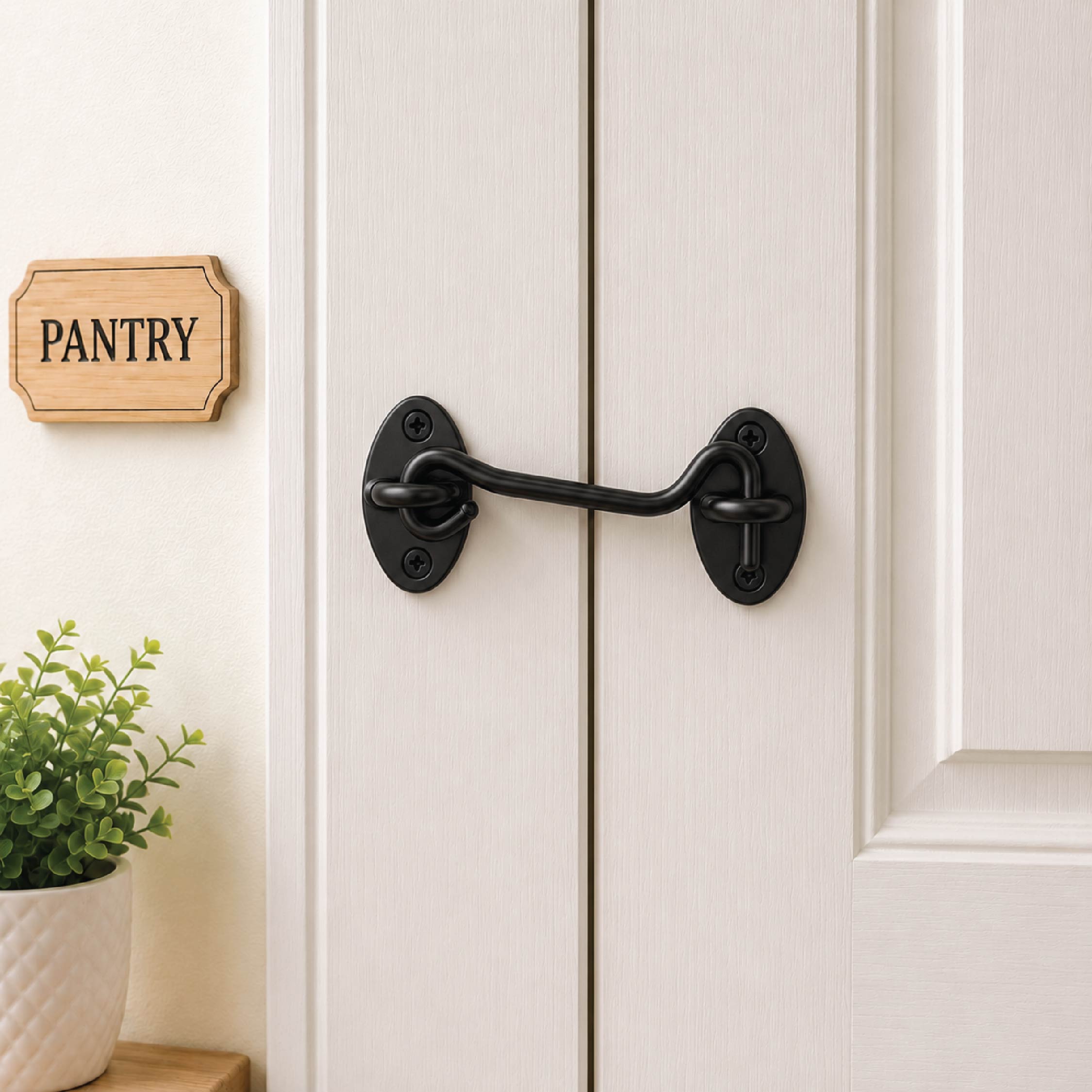 DOMIRA black hook and eye door
latch shown securing a wooden door
for reliable closure