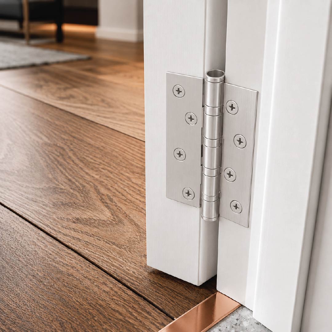 DOMIRA silver ball bearing door hinges installed on an external timber door with durable rust-resistant steel construction suitable for residential and commercial applications.