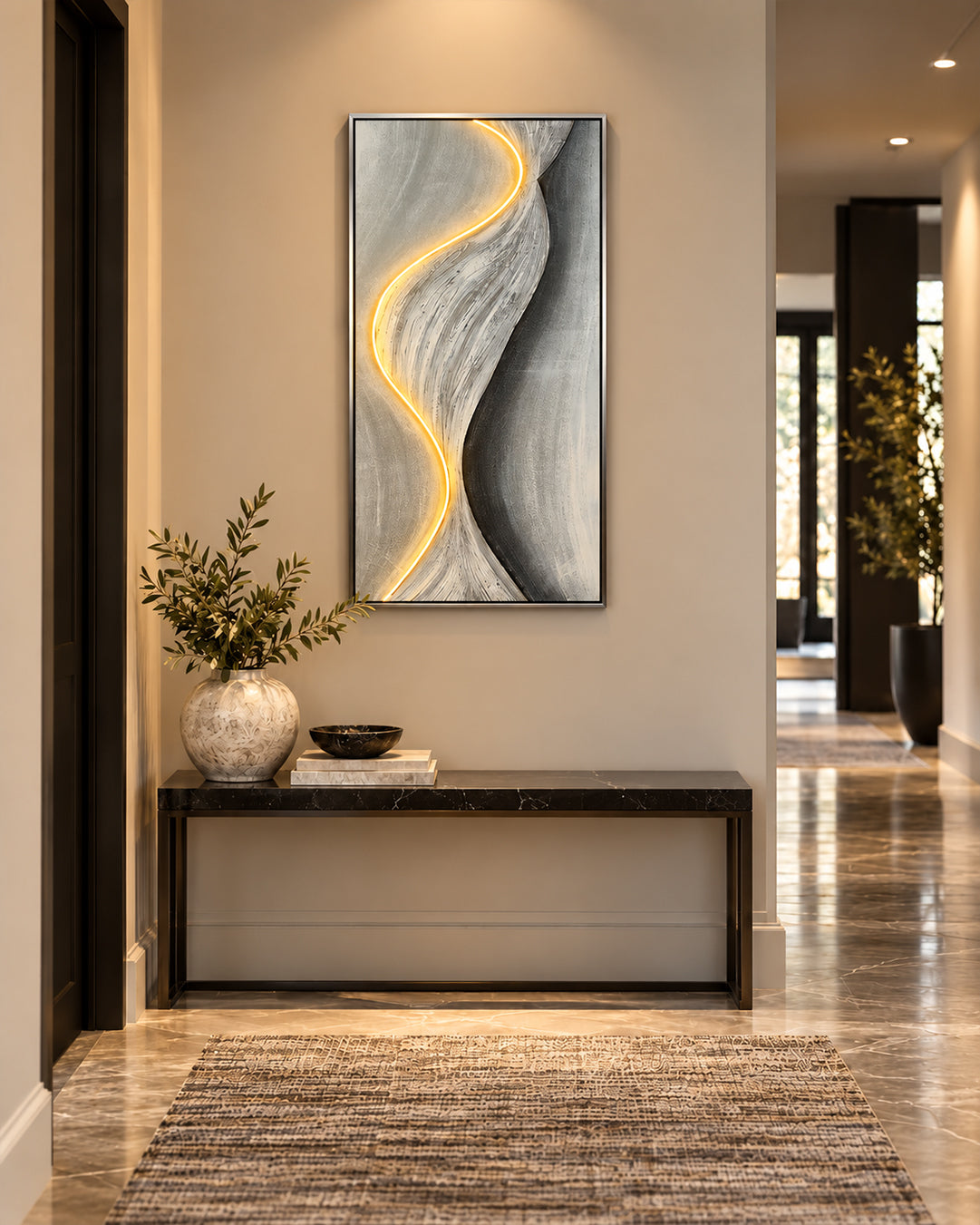 Drift of Light grey and gold LED canvas art in a hallway above a console