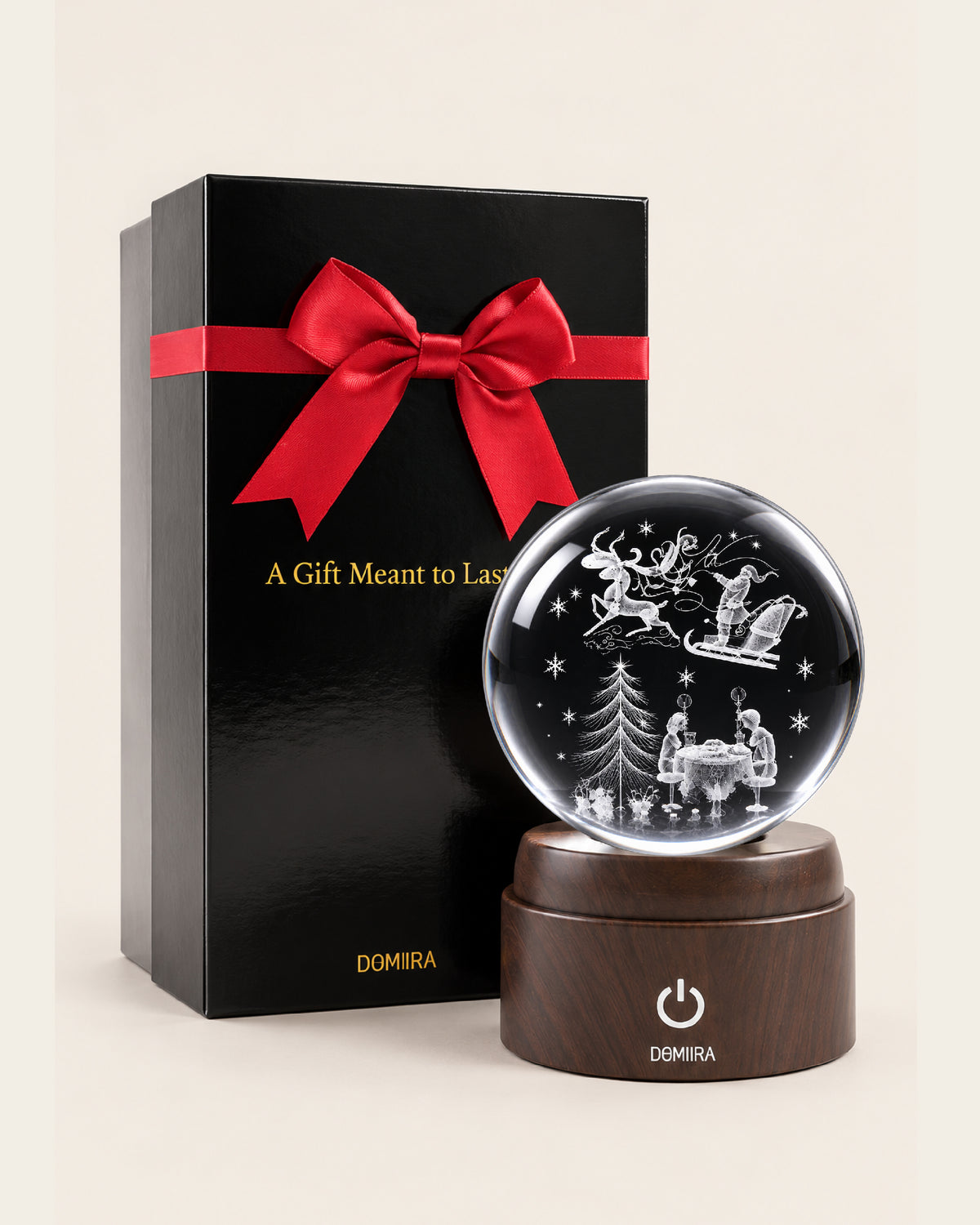 A December Evening crystal globe beside its ribbon-finished gift box