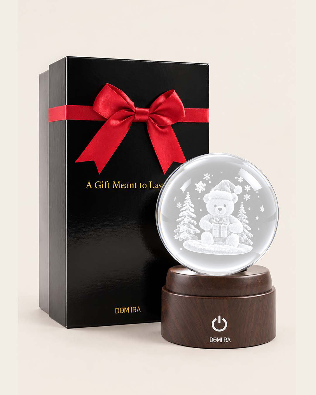 Wrapped in Wonder crystal globe beside its ribbon-finished gift box