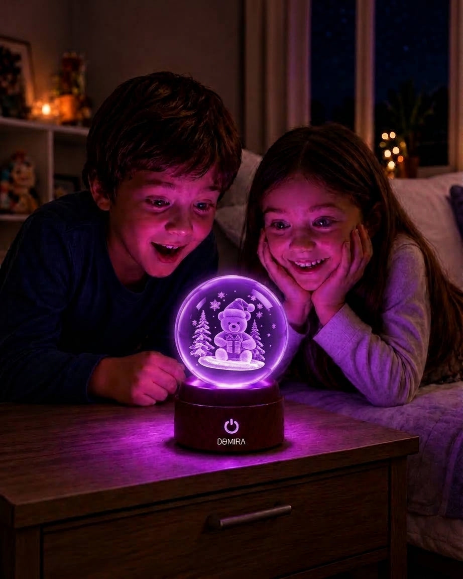 Two children admiring the Wrapped in Wonder crystal globe