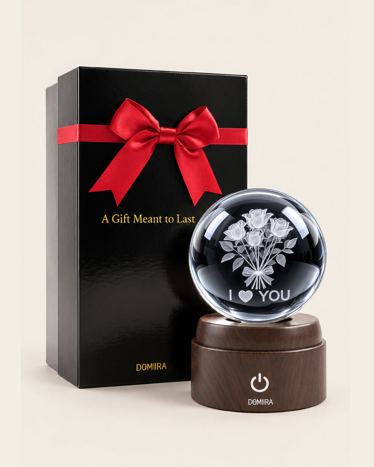 A Thousand Roses crystal globe beside its ribbon-finished gift box