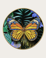 Metamorphosis round butterfly glass wall art front view in a gold metal frame