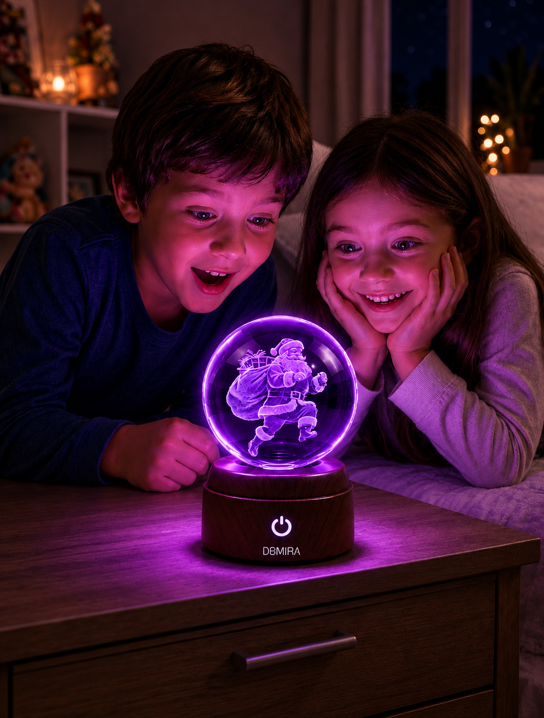 Two children admiring the Midnight Santa crystal globe