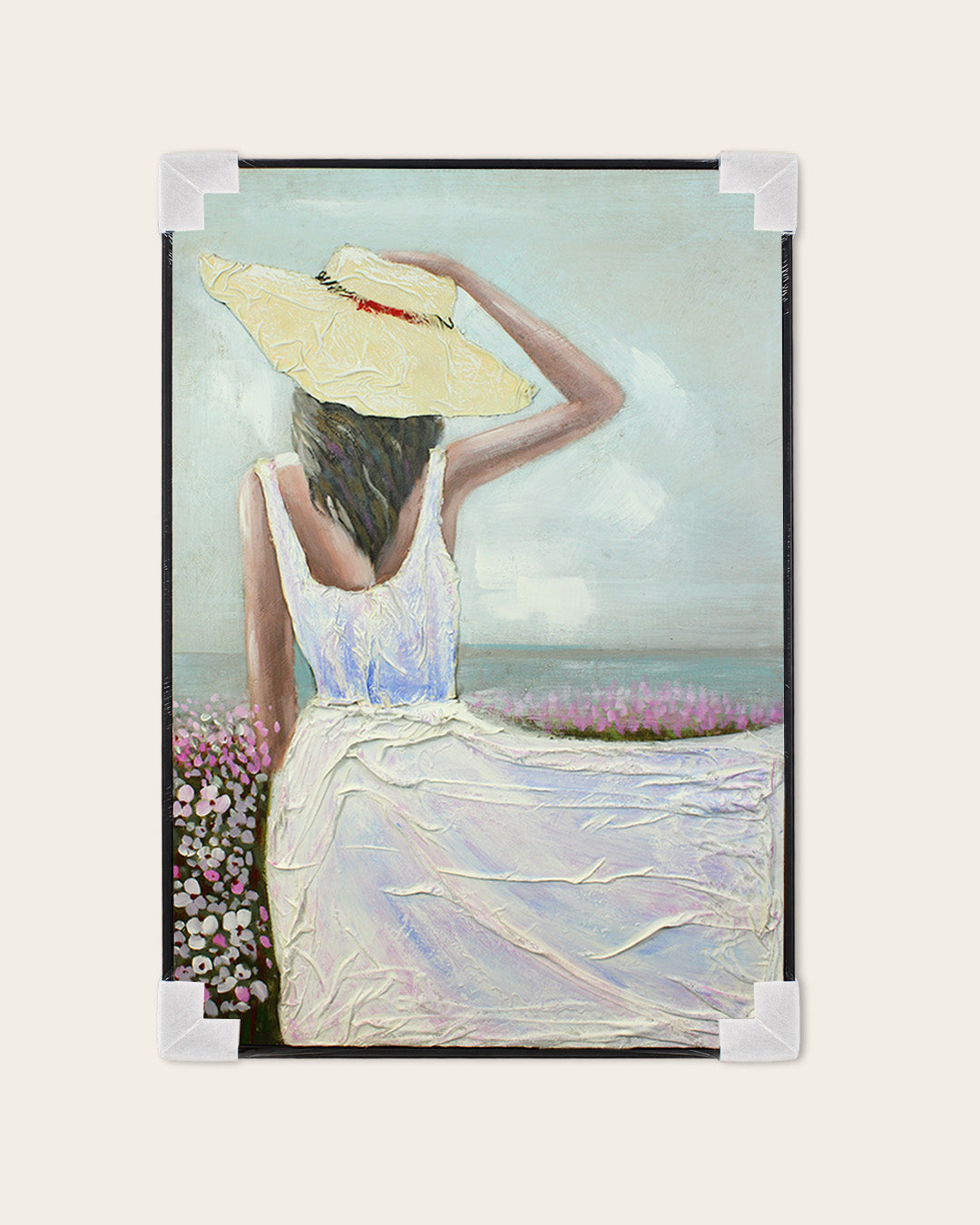 Sea Breeze woman in white dress painting with corner protectors for delivery