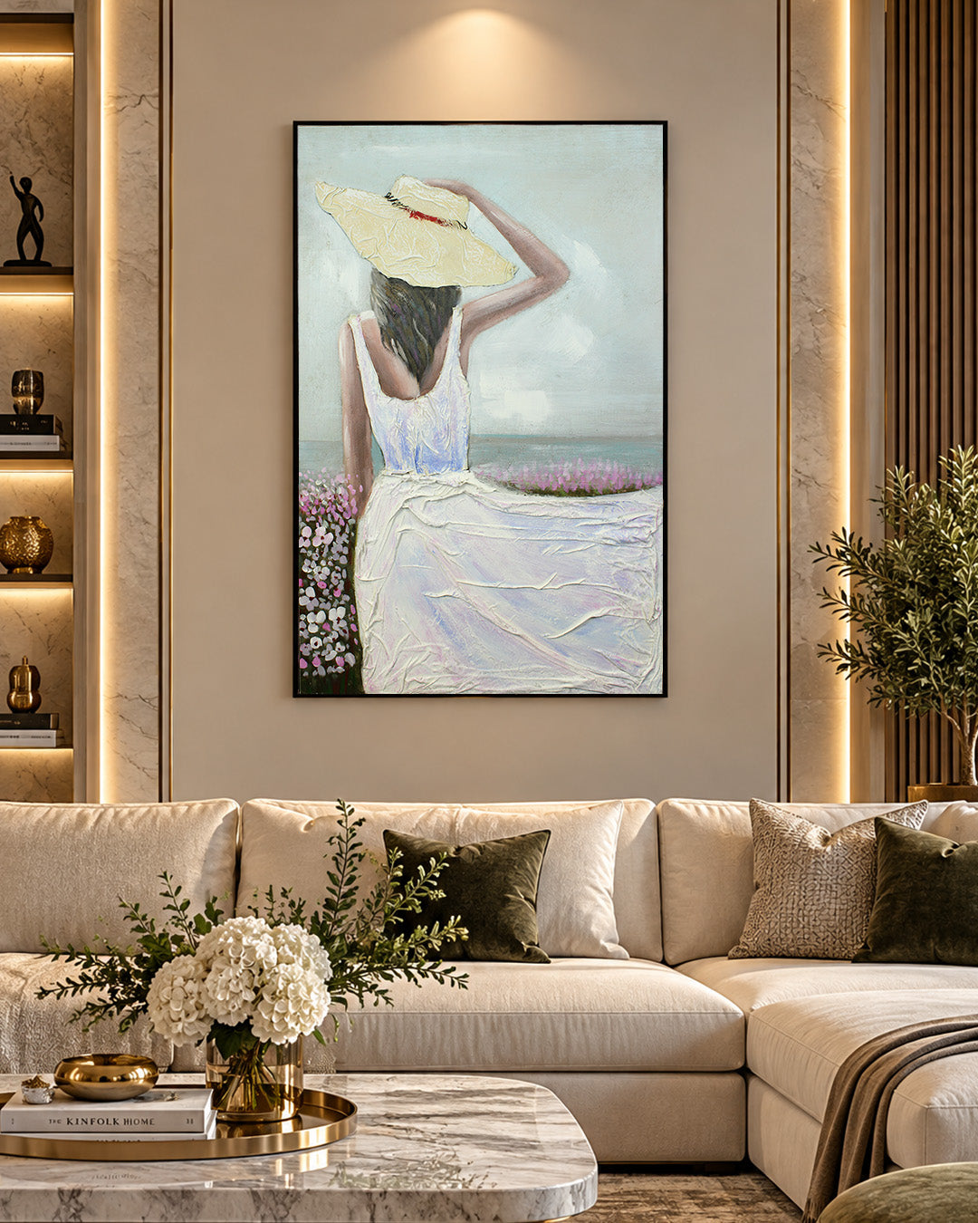 Sea Breeze woman in white dress painting above a sofa in a living room