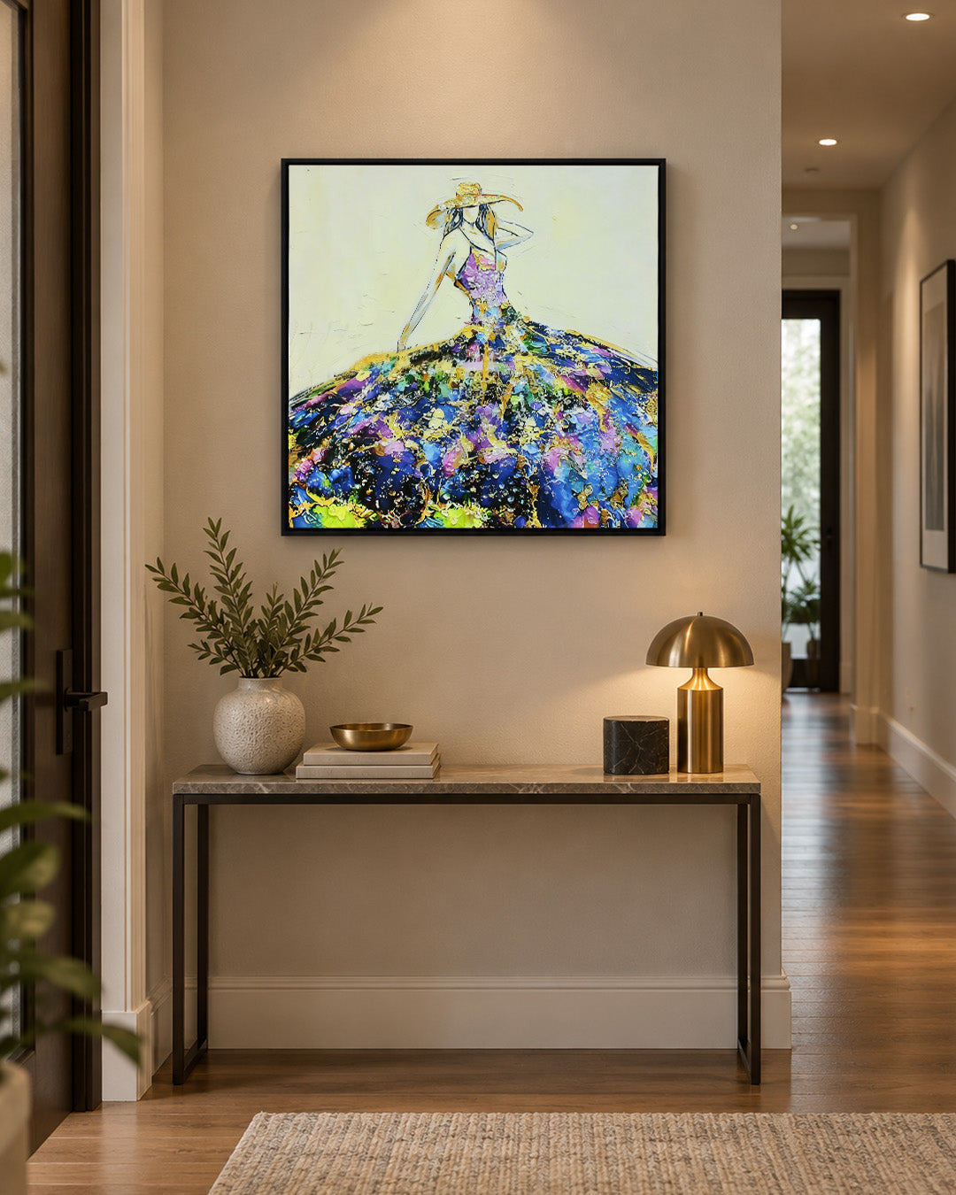 She Arrived woman resin wall art above a console in a hallway