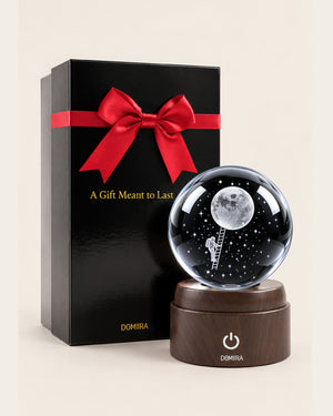Beyond Limits crystal globe beside its ribbon-finished gift box
