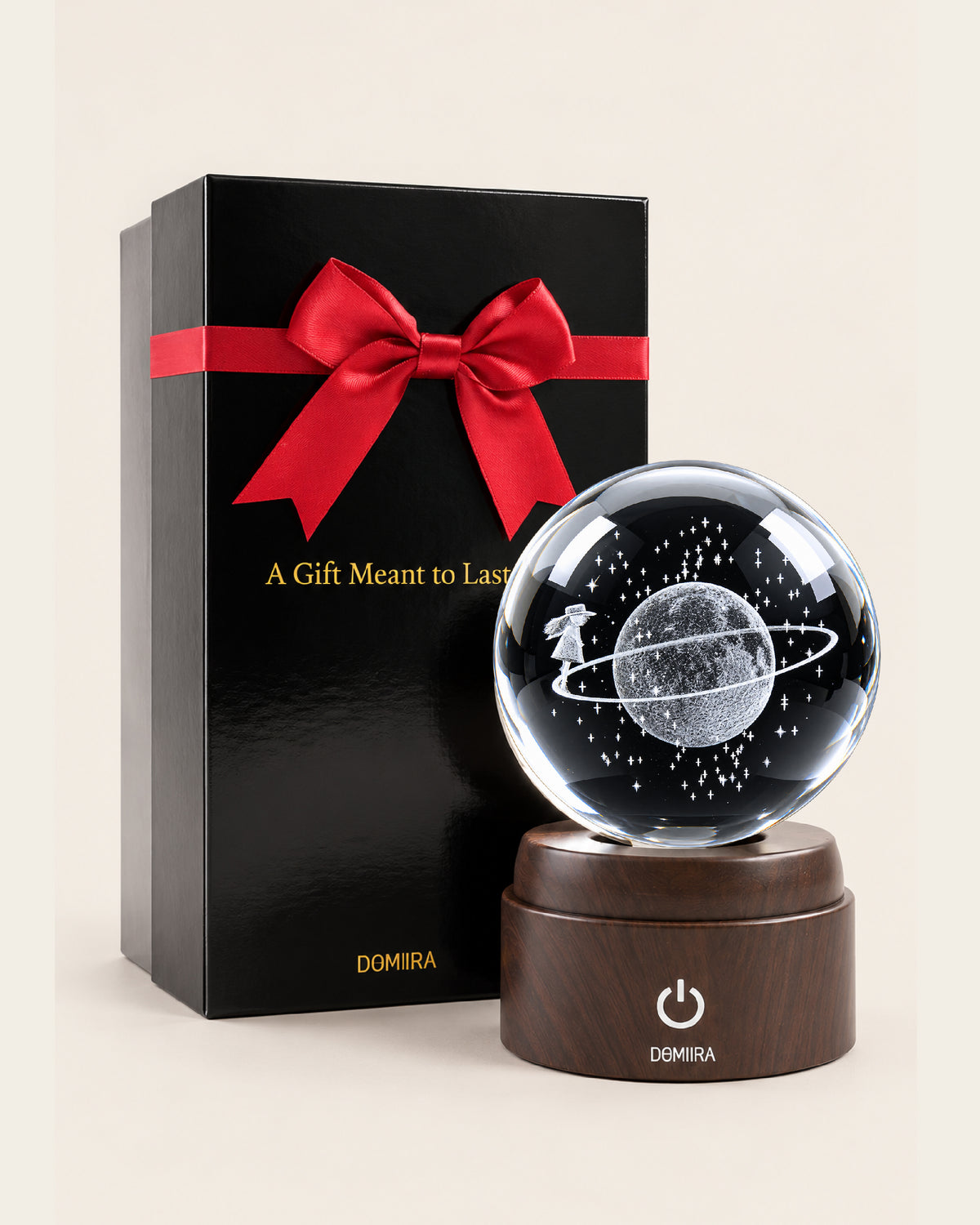 Orbital Dreams crystal globe beside its ribbon-finished gift box
