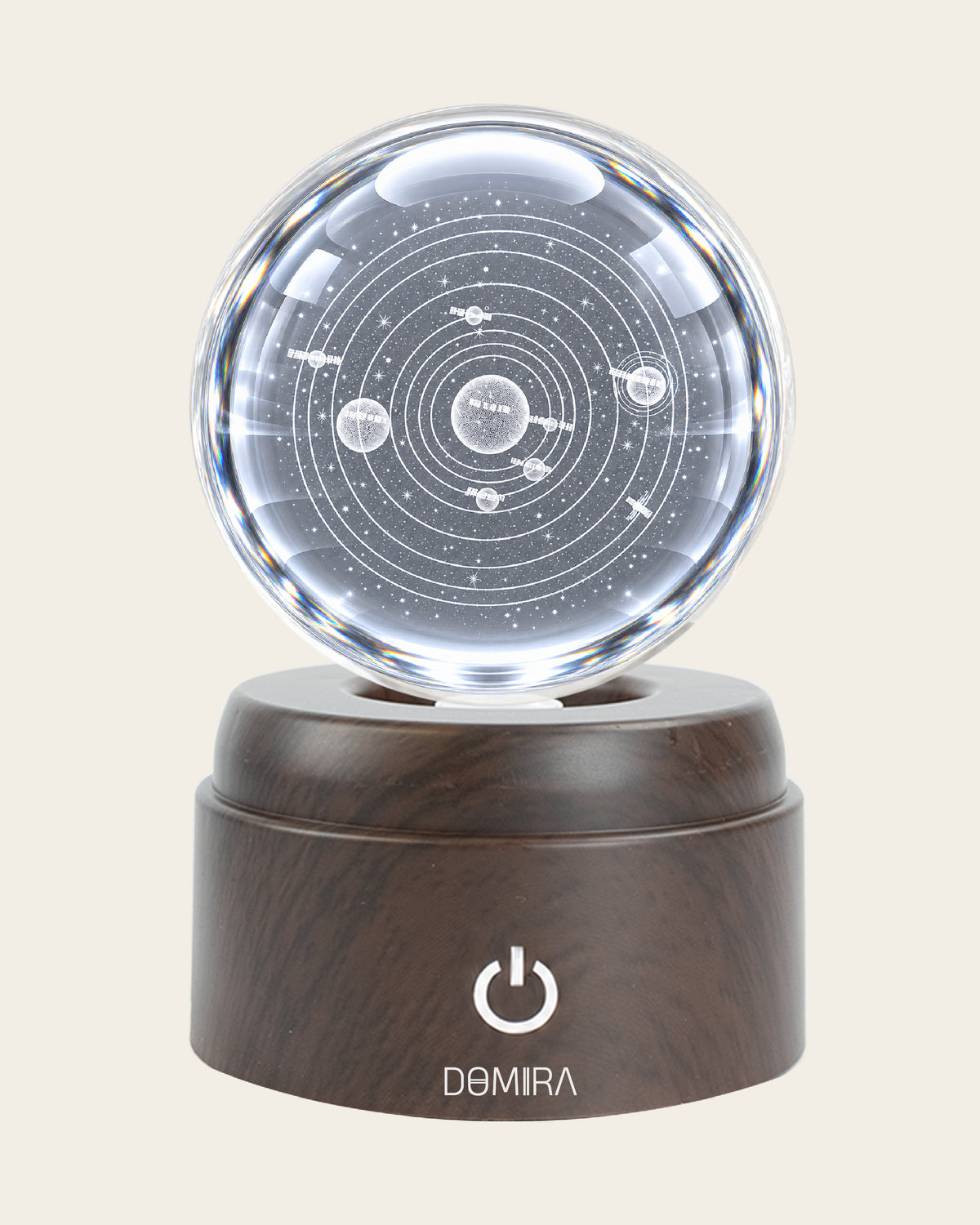 Solar Odyssey crystal globe front view on its rotating LED base