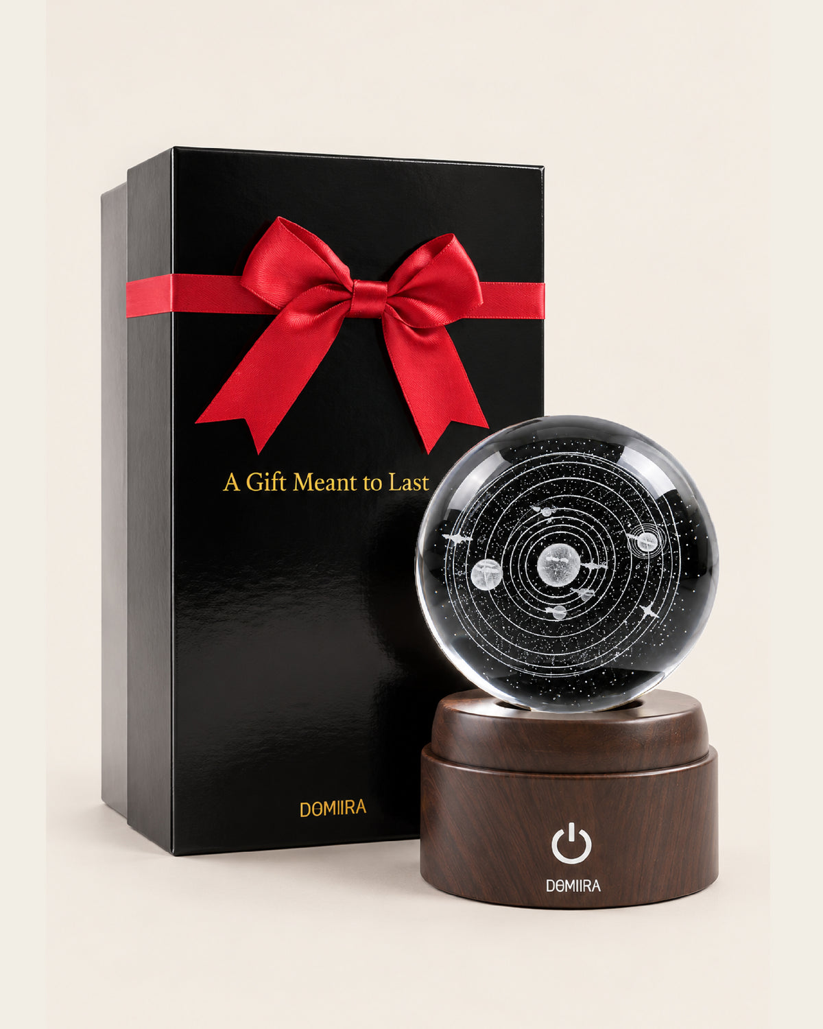 Solar Odyssey crystal globe beside its ribbon-finished gift box