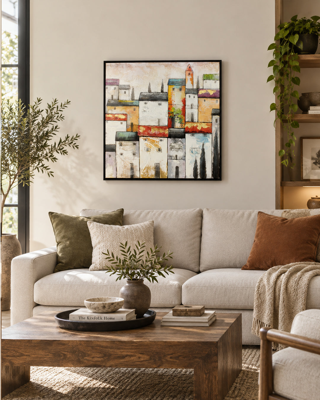 The Old Quarter Mediterranean village painting above a sofa in a living room