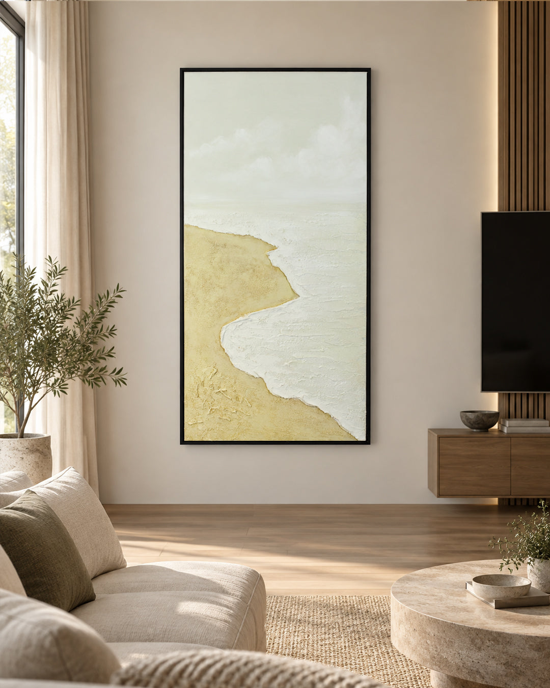 The Sea Comes Home minimalist beach painting above a sofa in a living room