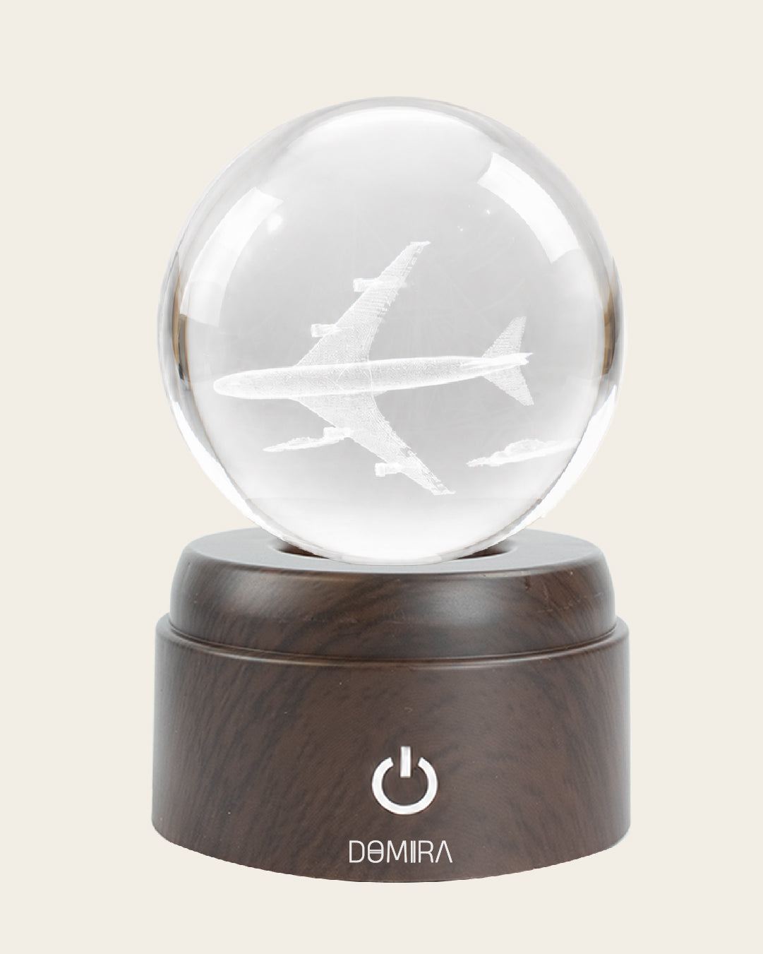 Chasing Horizons crystal globe front view on its rotating LED base