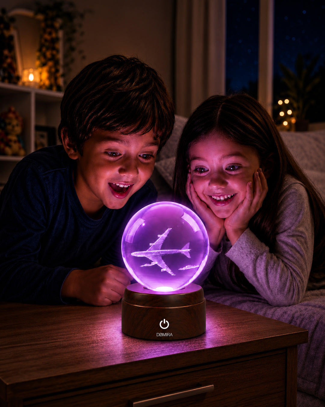 Two children admiring the Chasing Horizons crystal globe