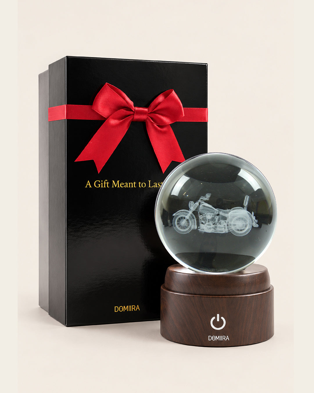 Freedom Ride crystal globe beside its ribbon-finished gift box
