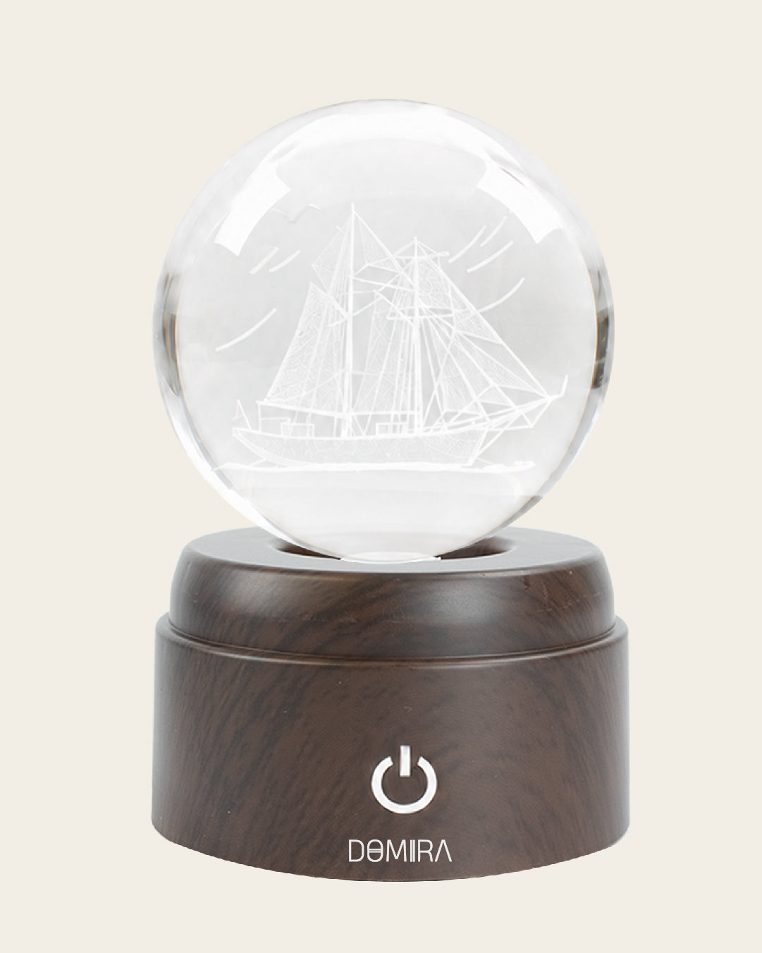 Ocean Wanderer crystal globe front view on its rotating LED base