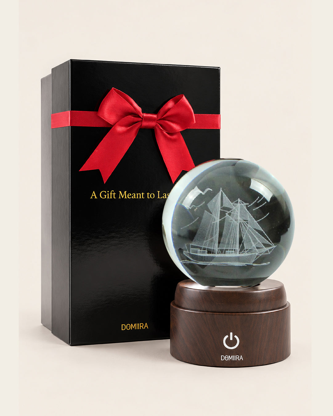 Ocean Wanderer crystal globe beside its ribbon-finished gift box