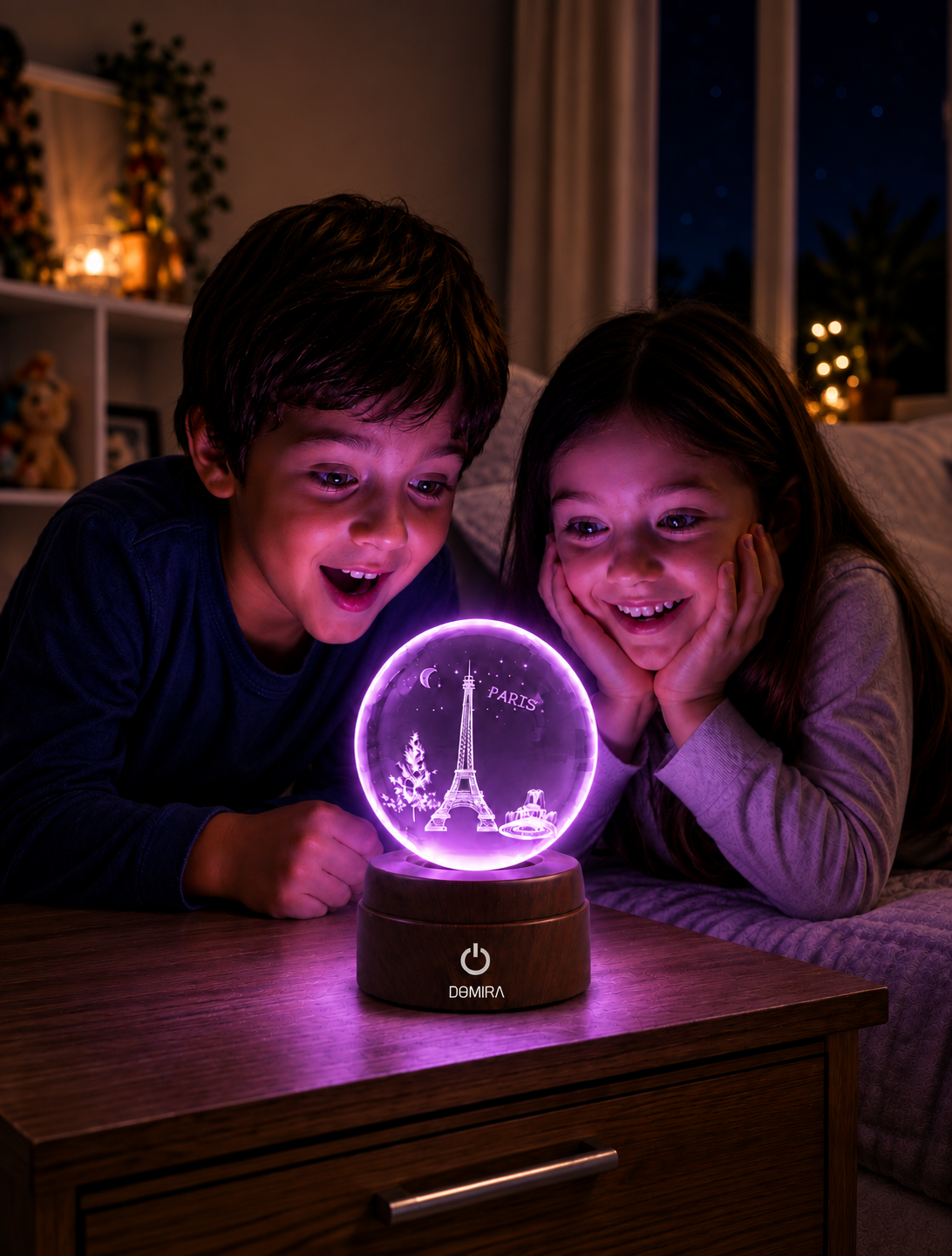 Two children admiring the Paris Forever crystal globe