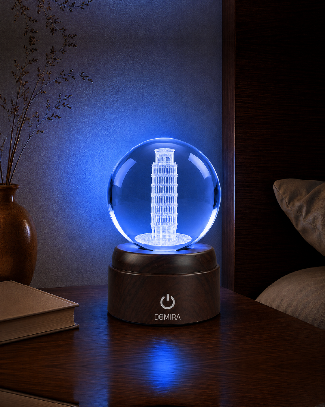 The Leaning Wonder crystal globe glowing blue
