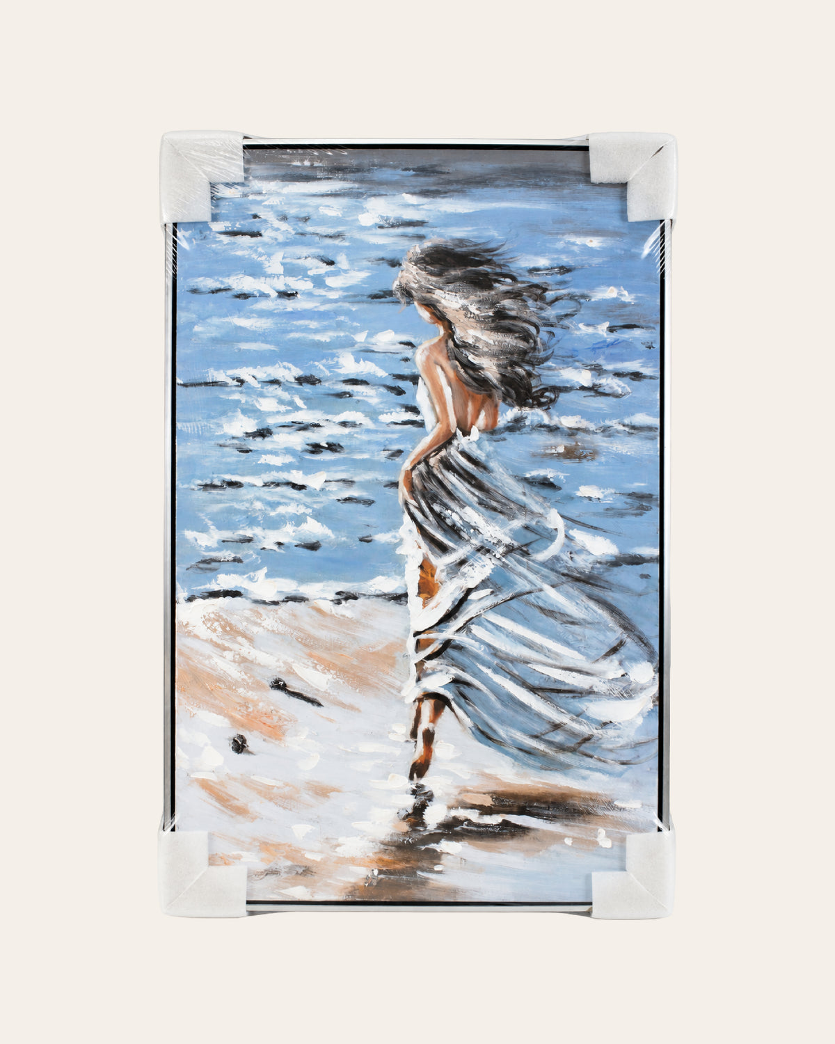Untethered woman by the sea painting with corner protectors for delivery