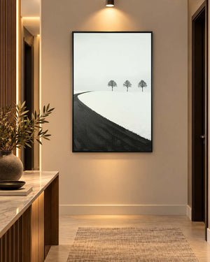 Winter Passage monochrome landscape art above a console table in a hallway